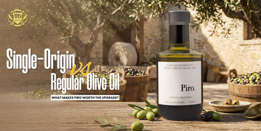 Tita Italia title banner comparing single-origin vs regular olive oil featuring a bottle of premium Piro Extra Virgin Olive Oil next to harvested olives.