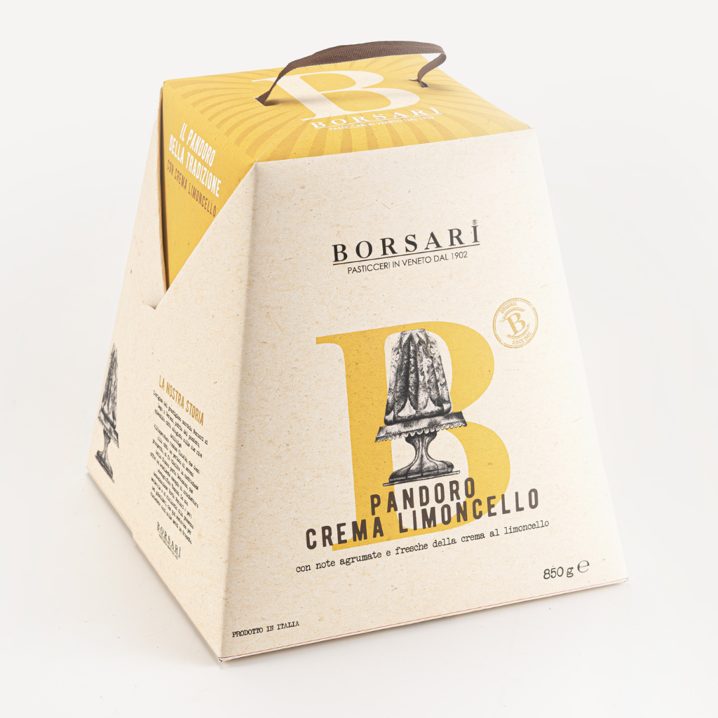Borsari Pandora Crema Limoncello packaged in a triangular cardboard carrier box with a handle, featuring a cream-colored exterior and a yellow graphic with an illustration of a Pandora jar.