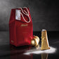 Italian Christmas pandoro cake with powdered sugar packet by Muzzi