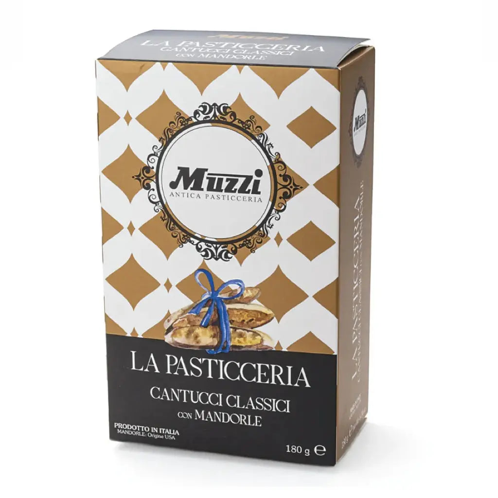 A packaged box of Muzzi brand Cantucci Almond Biscuits, with a decorative pattern and the product visible through the transparent window.