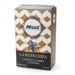 A packaged box of Muzzi brand Cantucci Almond Biscuits, with a decorative pattern and the product visible through the transparent window.