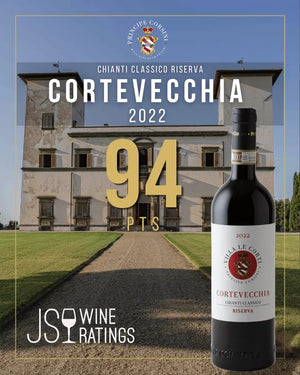 A wine bottle labeled Chianti Classico Riserva Cortevecchia 2022 shown in front of a large estate building, with large overlaid text reading 94 PTS and a JSO Wine Ratings logo. This is not a clean standalone product shot because the scene and text graphics dominate the presentation, so I classify it as Other rather than Product/Packaging or Lifestyle.