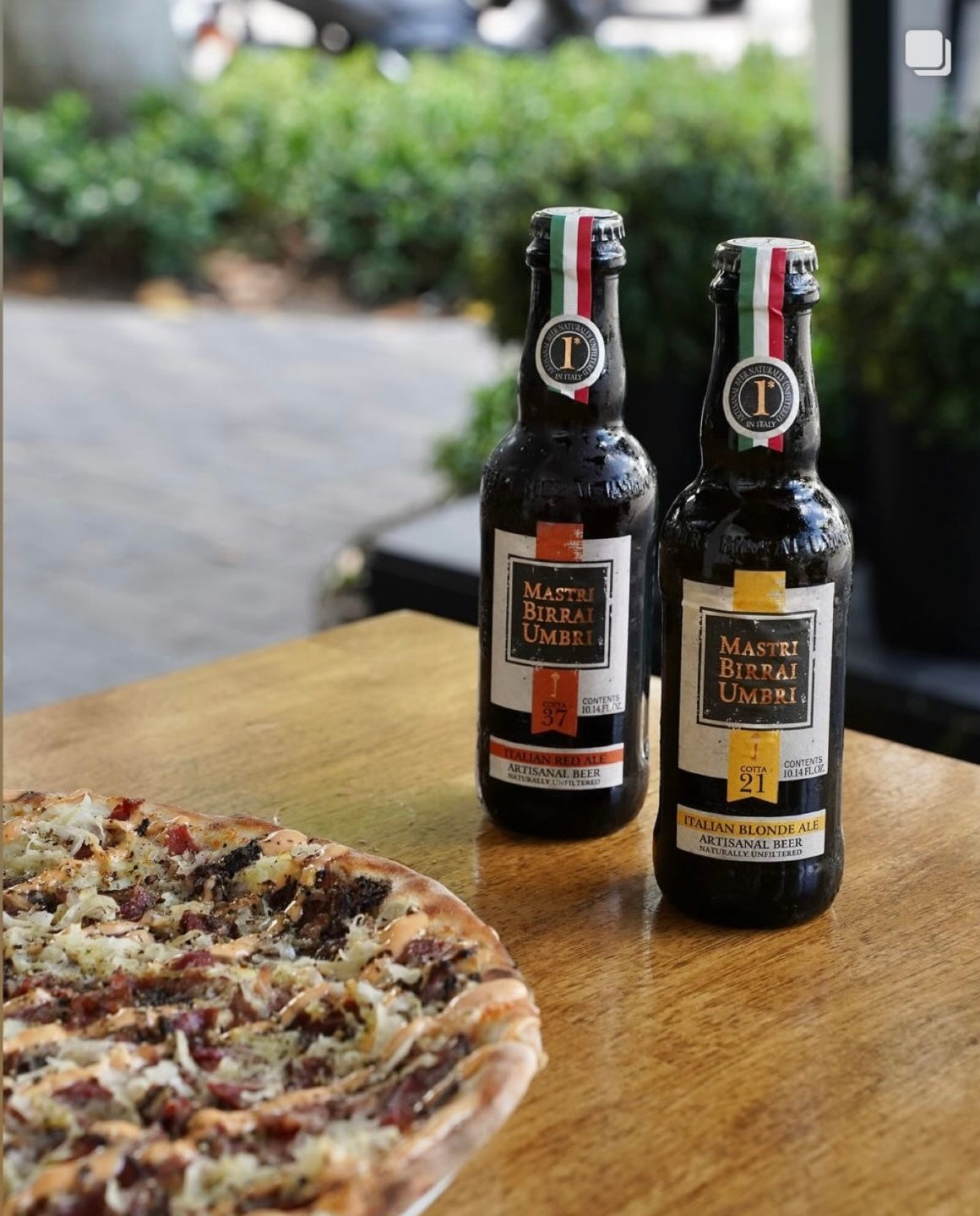 two bottles of mastri birrai umbri beer