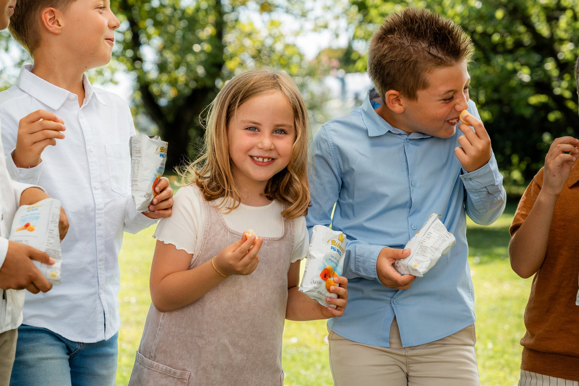 some kids enjoying with bibanesi breadsticks