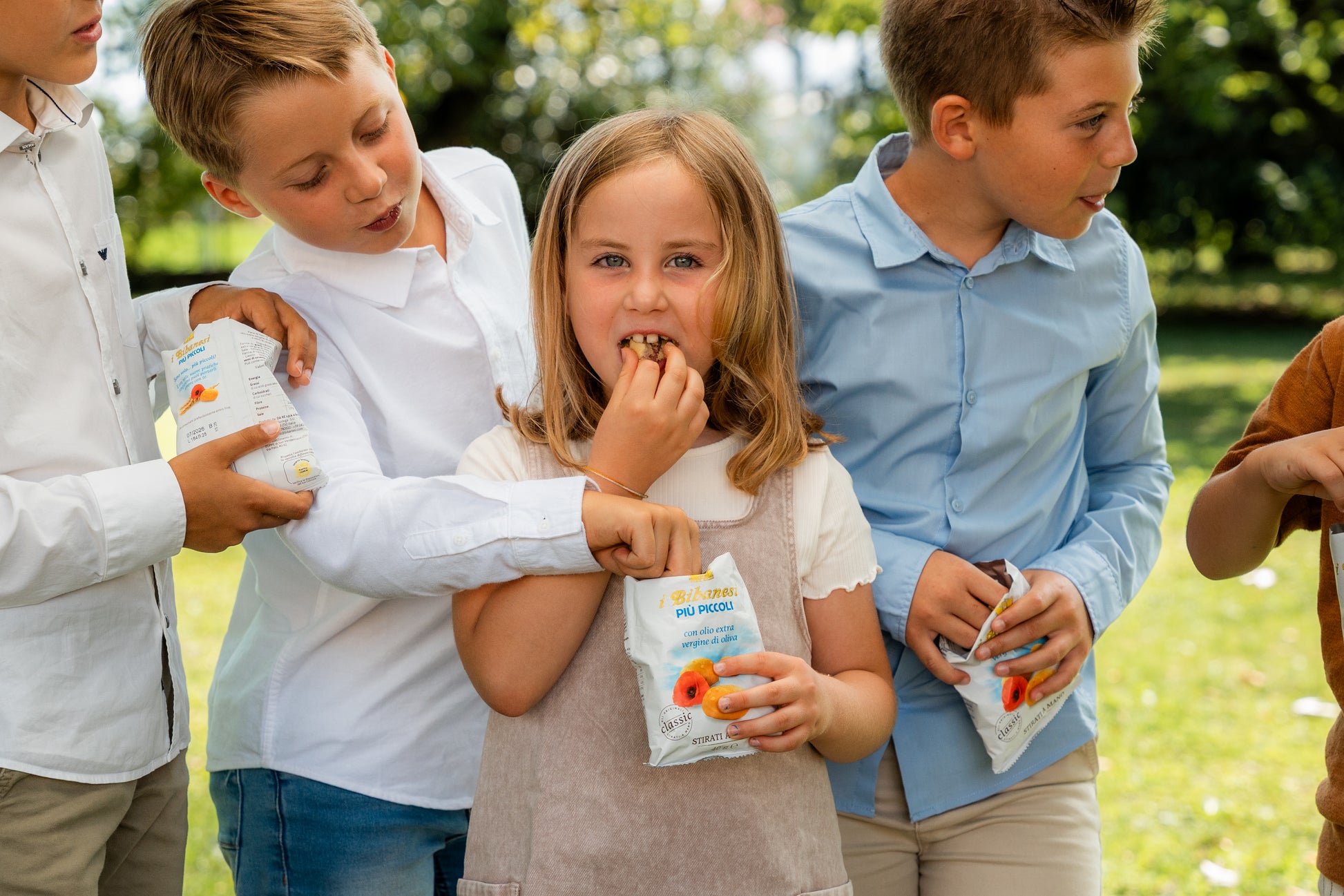 some kids enjoying with bibanesi breadsticks