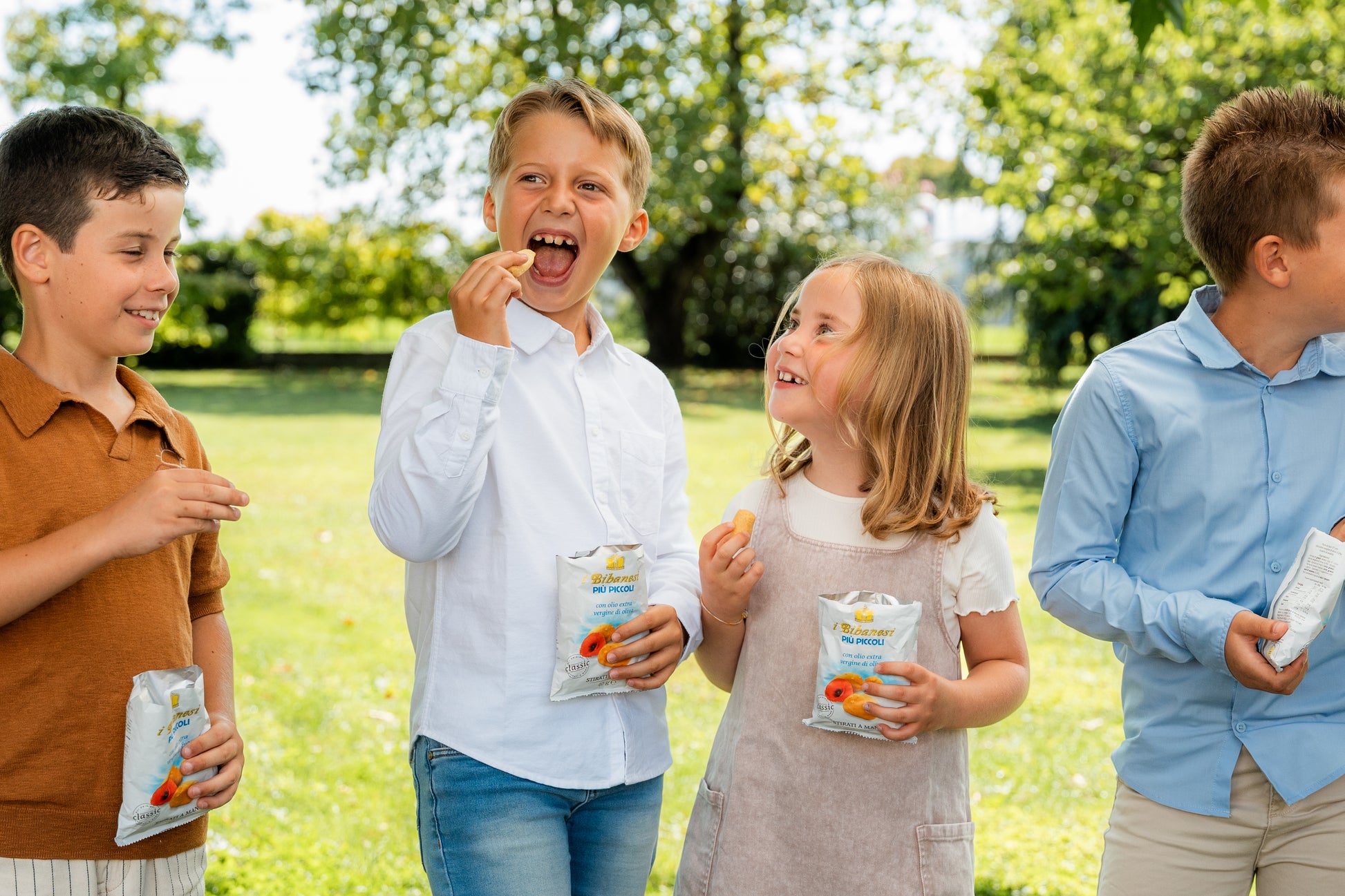 some kids enjoying with bibanesi breadsticks