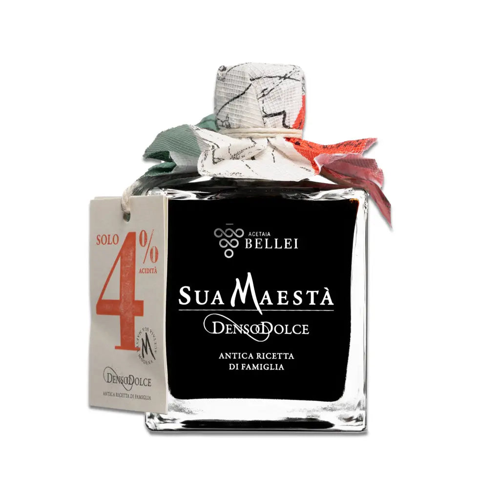 Bottle of Sua Maest  Denso Dolce with decorative packaging on a white background