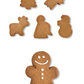 Caramel and cinnamon Christmas-shaped cookies with decorated cookie figure