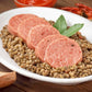 italian cotechino with lentils on a wood table