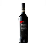 A bottle of Montefalco Sagrantino D.O.C. Exubera Terre De La Custodia wine with a dark label and red text.