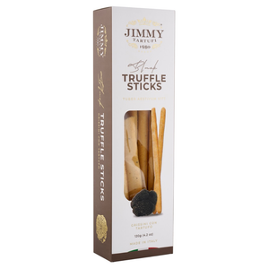 Jimmy Tartufi Truffle Sticks in a tall white and brown cardboard box with a clear window showing the sticks inside, photographed on a light gray background.