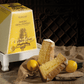 Pandoro with Limoncello cream on a wooden surface with a box in the background