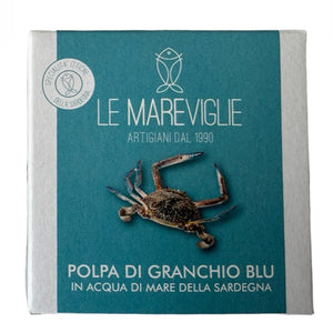 Product packaging with a crab illustration and branding on a blue background