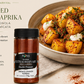 papas bravas served with smoked paprika on the top on a white background