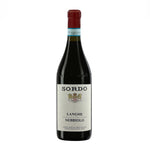 Bottle of Sordo Langhe Nebbiolo wine with a red label and the brand's coat of arms on the label.