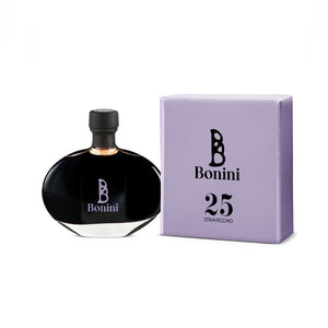 A bottle of Bonini Stravecchio 25-Year Aged Balsamic Vinegar next to its purple packaging box.