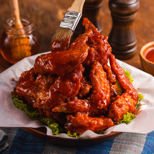 Fried Chicken wings with truffle hot chili dressing of Chef Truffle on a table 