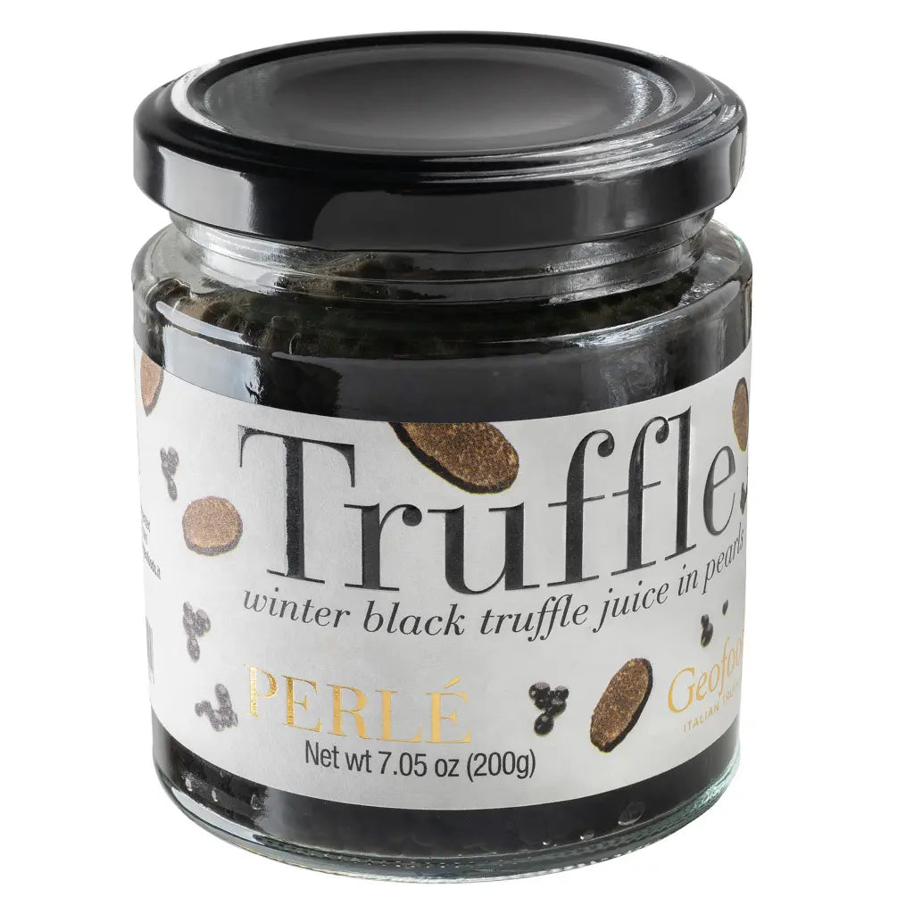 A glass jar of Perlé winter black truffle juice in peony, featuring a white label with black and gold text and illustrations, sealed with a black lid on a white background.