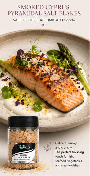 Salmon dish with smoked cyprus pyramidal salt flakes on a plate, accompanied by a jar of salt flakes. Asparaus on the side
