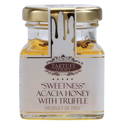 A glass jar of Tartufi Jimmy 'Sweetness' Acacia Honey with Truffle, featuring a white label with gold lettering and a gold metal lid, set against a plain white background.