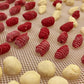 Red and white gnocchi on a mesh tray