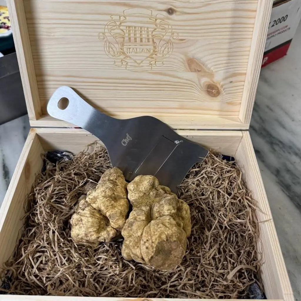 white truffle basket with a truffle slicer